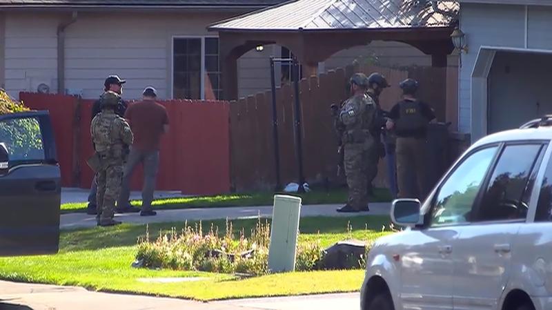 FBI agents outside Ashton Ellaboudy’s home in Richland, Washington, at his October 2026 arrest